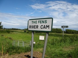 Sign besides the river